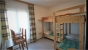 1. Schlafzimmer Gruppenhaus FAAK AM SEE