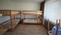 2. Schlafzimmer Gruppenhaus FAAK AM SEE
