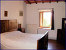 1. Schlafzimmer Gruppenhaus LE CAMPORA